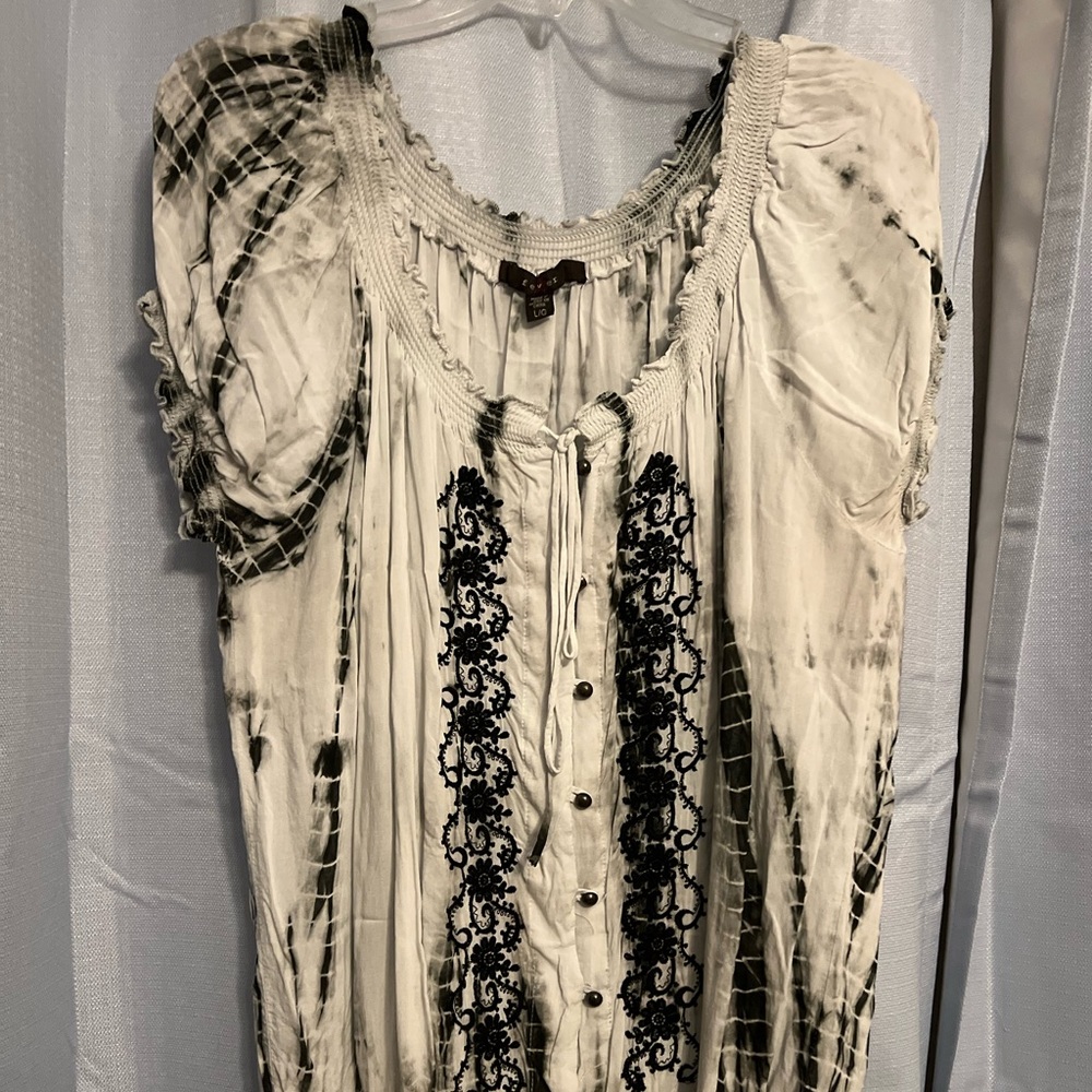 Gray. Faded black gray. Gathers around neck line and bottom. Comfortable